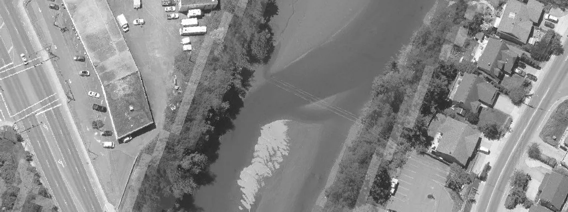 Aerial view of a paved parking area with vehicles