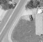Aerial view of a residential property near a roadway