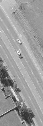 Aerial view of a road through a residential neighborhood