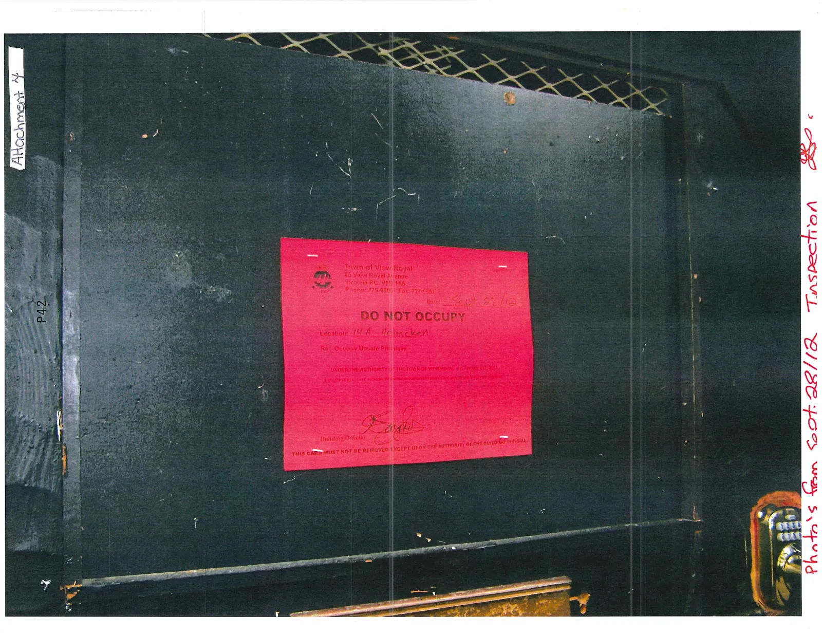 Red notice titled "DO NOT OCCUPY" posted on a dark surface