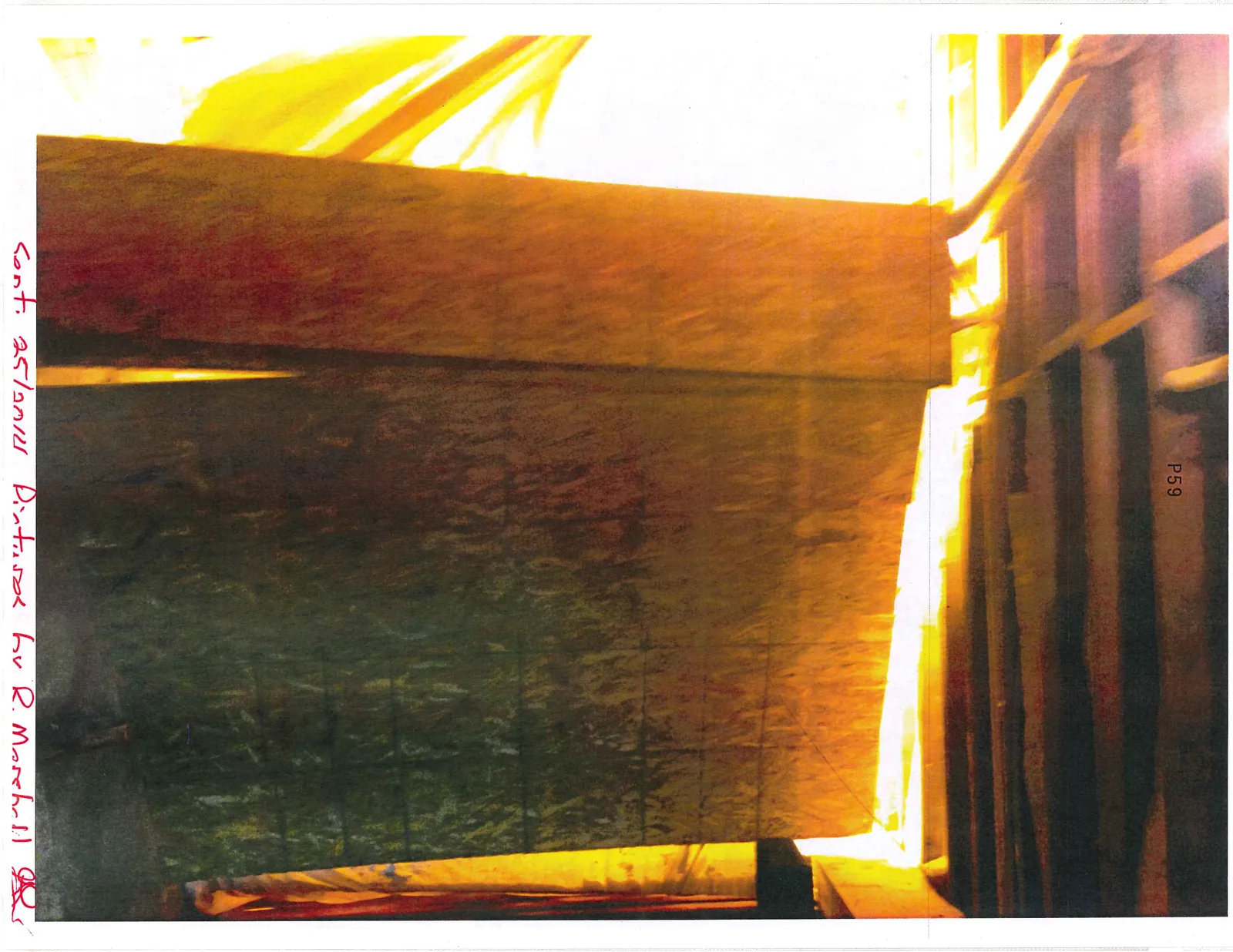 OSB plywood panels leaning against a wall with bright light illuminating the gaps.