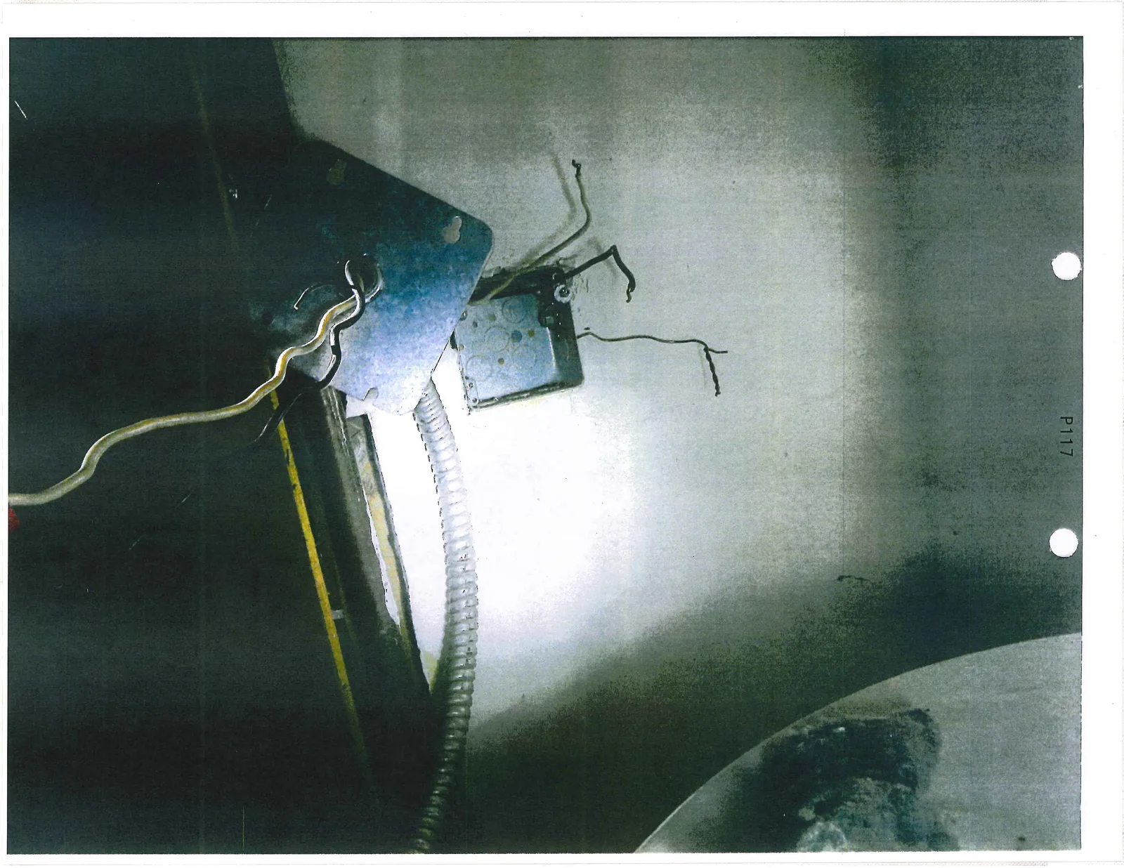 Electrical junction box with exposed wires and a detached metal cover plate