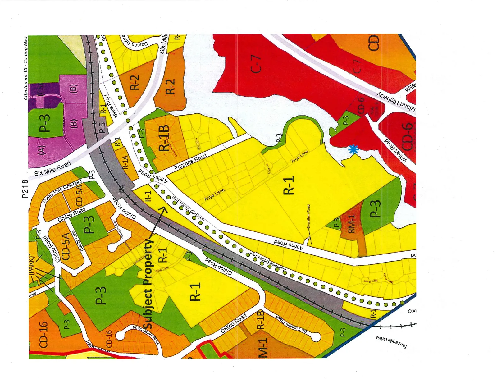 Zoning map highlighting a "Subject Property" within an R-1 zoned area. The map shows surrounding zoning designations including CD-16, P-3, CD-5A, R-1A, R-1B, R-2, RM-1, M-1, C-7, and CD-6. Key geographic features and roads labeled include Chilco Road, Atkins Road, Six Mile Road, Island Highway, Wilfert Road, and the Galloping Goose Trail.