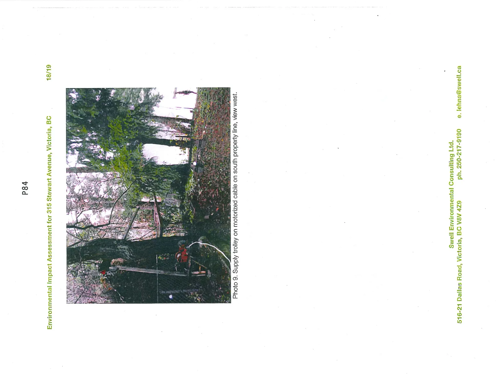 Photo 9. Supply trolley on motorized cable on south property line, view west.