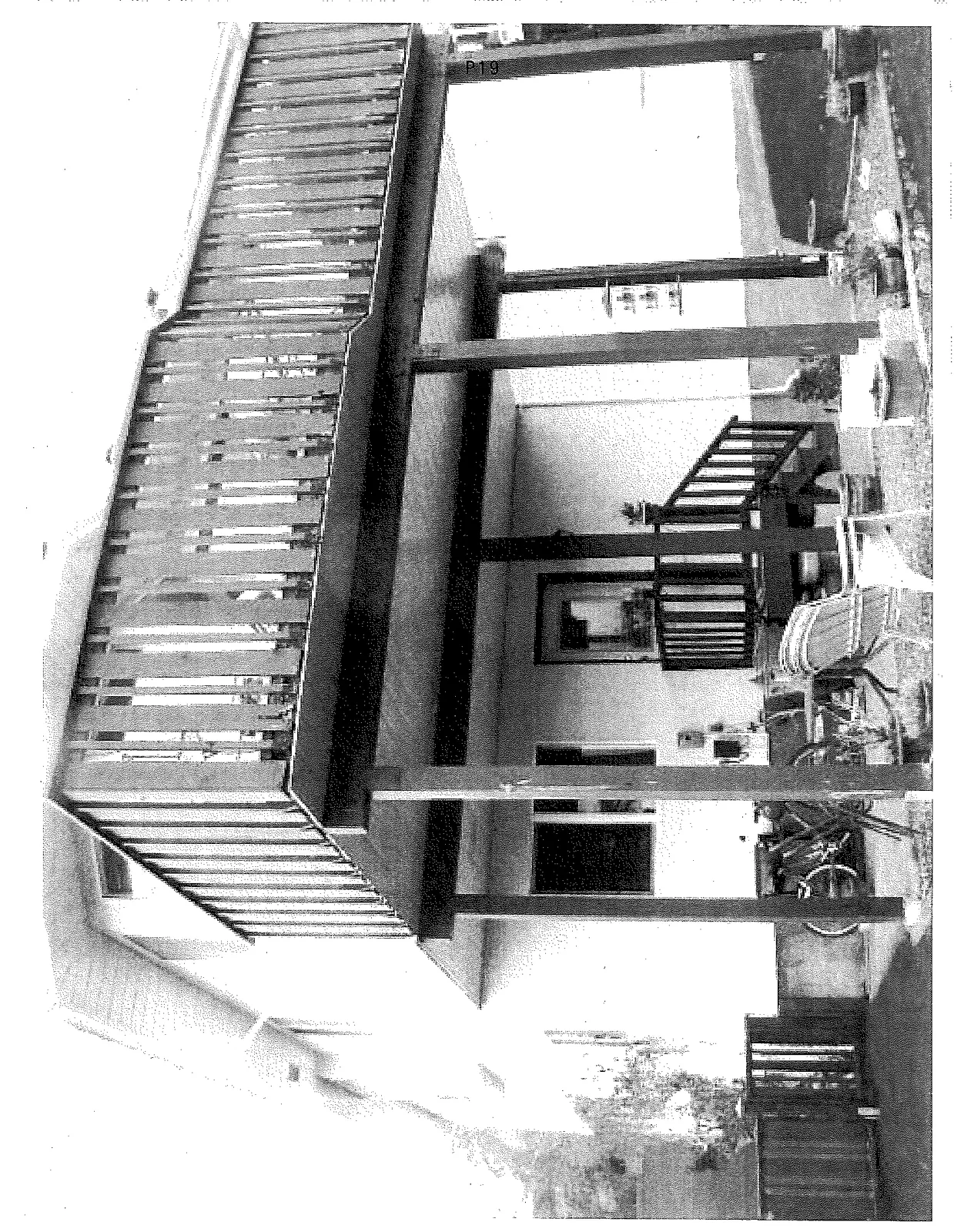 Exterior view of existing two-level wooden deck structure and support posts at 2329 Evelyn Heights