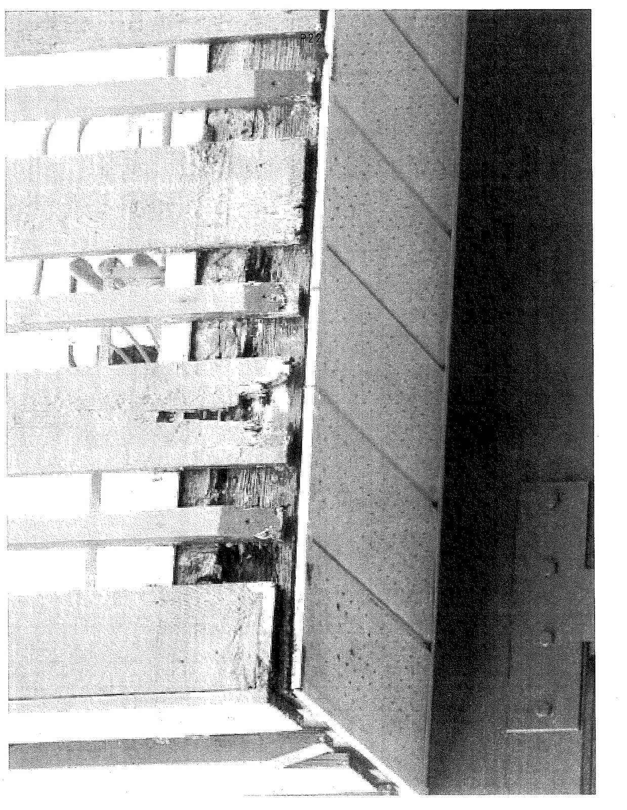 Close-up photograph showing wood rot and deterioration on the existing deck structure where it connects to the residence at 2329 Evelyn Heights