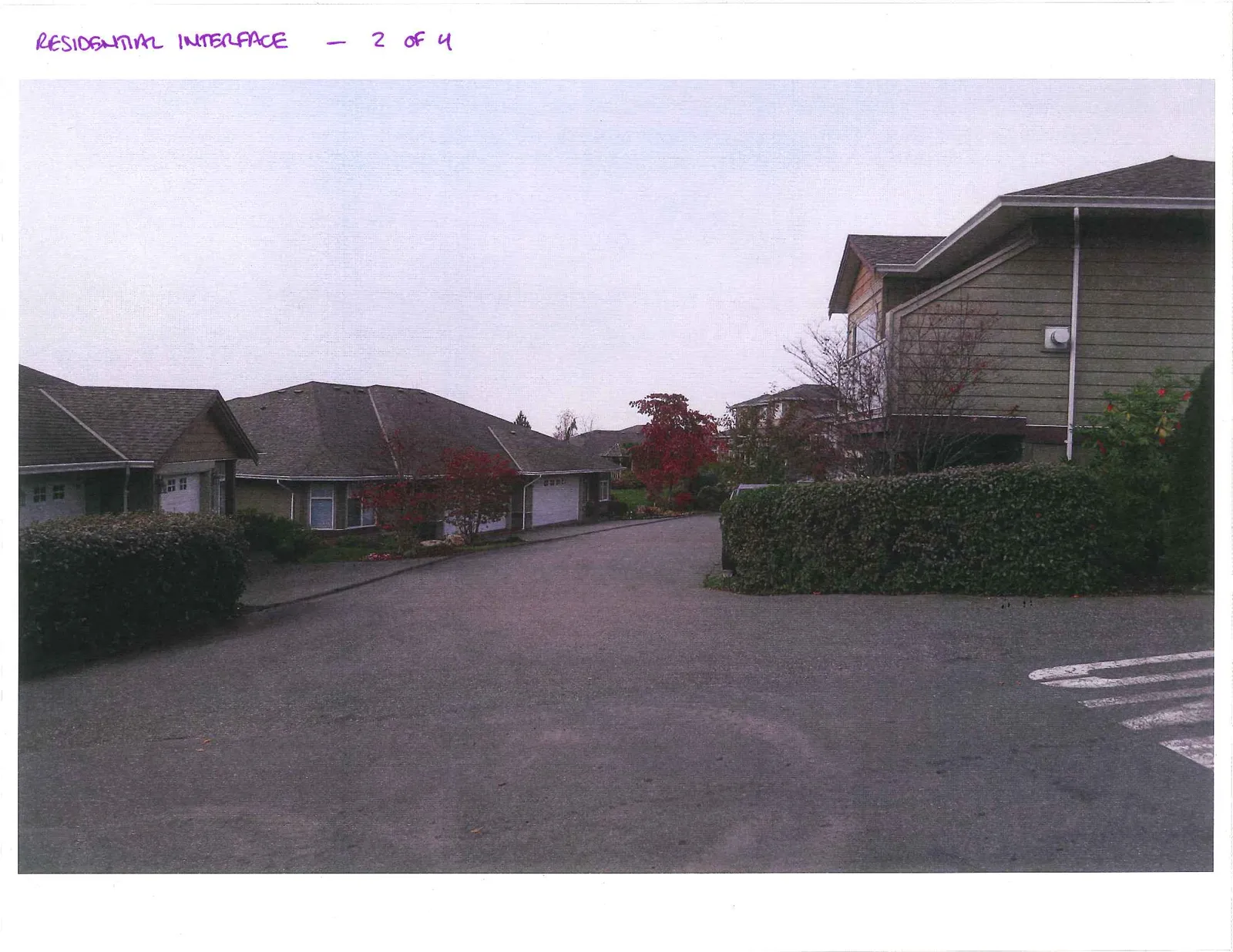 View of the residential buildings and paved internal driveway at 126 Hallowell Road.