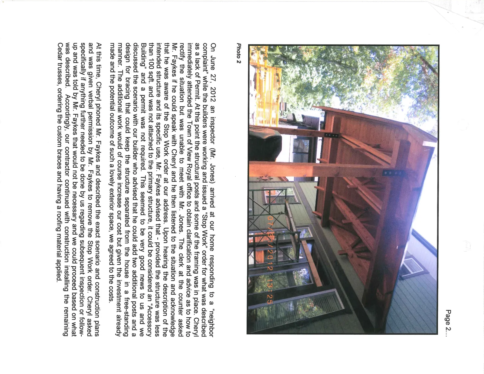 Photo 2 - Close-up view of the timber framing, trusses, and custom braces of the new outdoor structure under construction