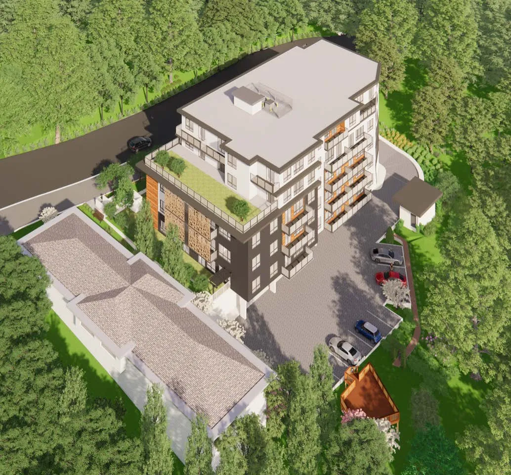 A 3D aerial rendering of a modern multi-story residential building featuring balconies and a green rooftop terrace, an adjacent paved parking area with vehicles, and a smaller neighboring building, all surrounded by a dense forest.