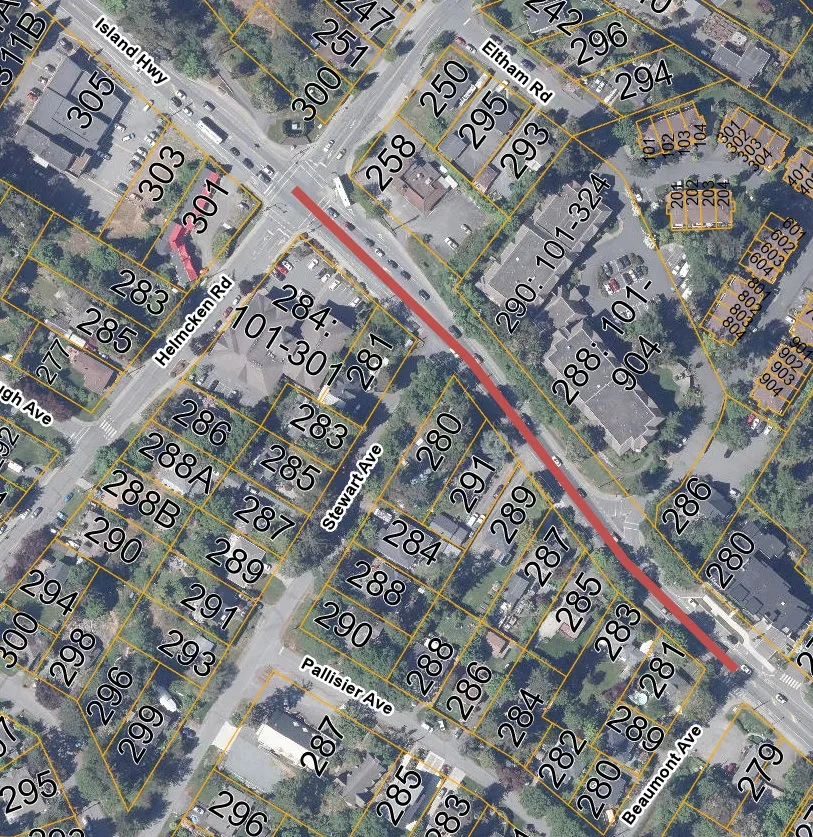 Aerial map showing proposed Island Highway upgrades from Helmcken Road to Beaumont Avenue with property parcel numbers highlighted.