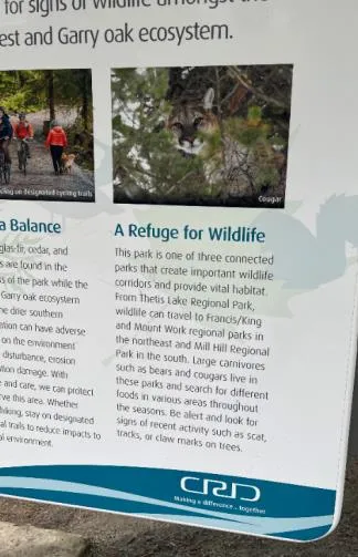 CRD informational sign titled "A Refuge for Wildlife" featuring a photo of a cougar and text