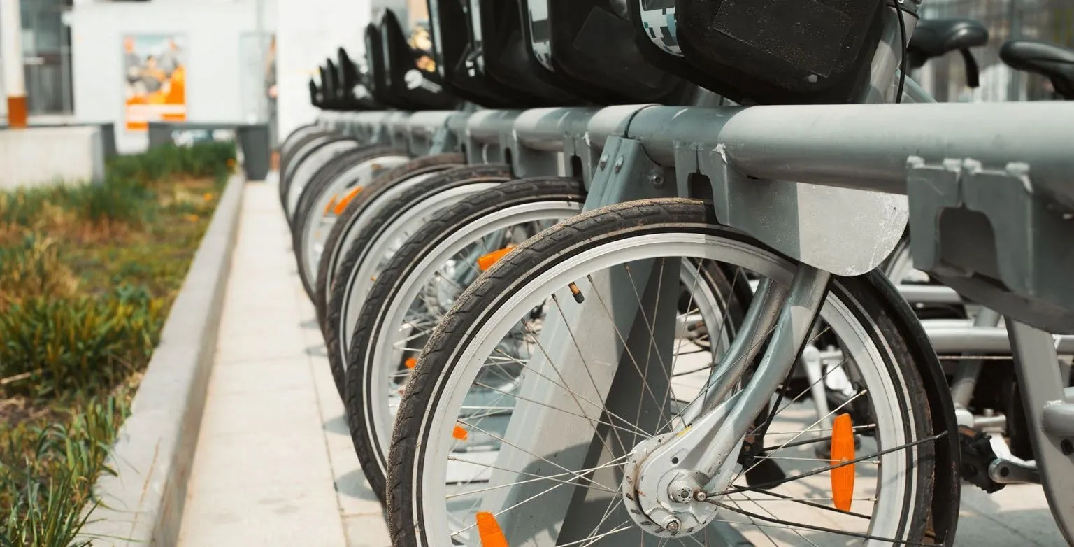 Bicycle parked at a bus stop rack