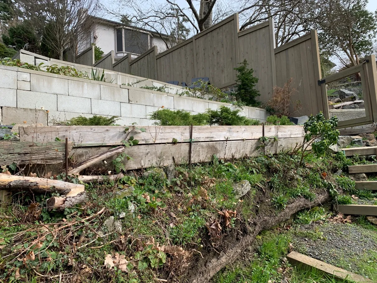 Photo 10. Existing shoreline access path and stairs, with wood (failing) and concrete block retaining walls.