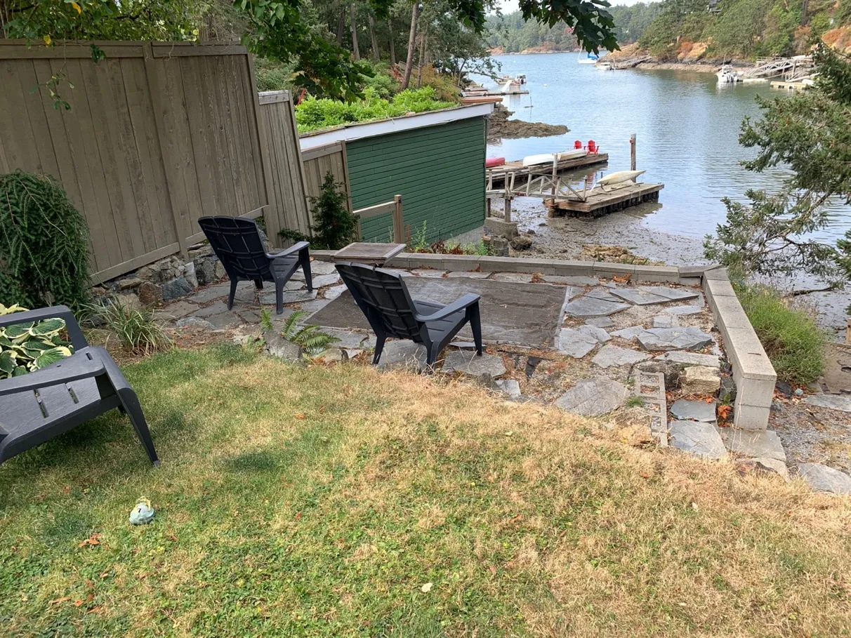 Photo 12. Existing shoreline access path and stairs, with wood (failing) and concrete block retaining walls.
