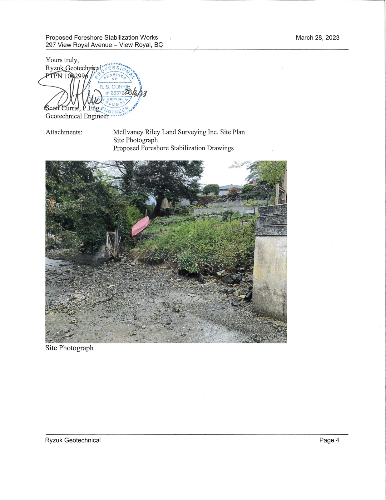 Site Photograph of the shoreline area featuring rocky terrain, green shrubs, a red kayak, and a concrete wall