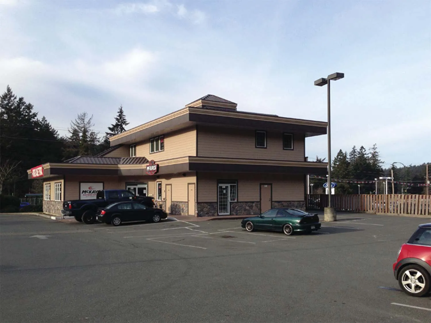 Side and rear view of the existing building as seen from the adjacent parking area.