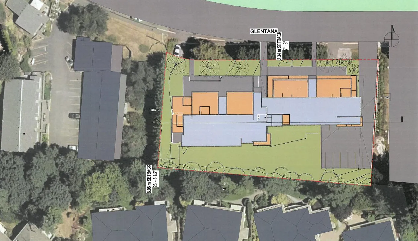 Aerial site plan showing building footprint, landscaping, and setbacks relative to surrounding properties