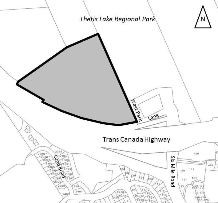 Map showing a shaded parcel of land located south of Thetis Lake Regional Park and north of the Trans Canada Highway, with adjacent roads including West Park Lane, Lund Road, and Six Mile Road.
