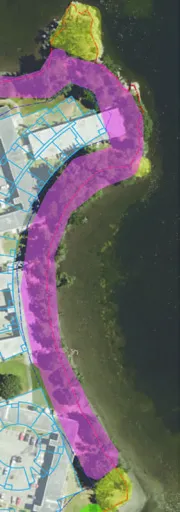 Close-up section of aerial map showing road and parking area