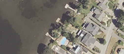Aerial view of northern shoreline with buildings and vegetation