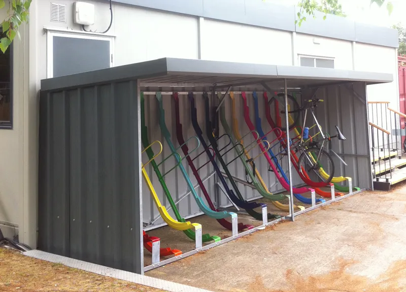 Indoor bicycle storage room with various floor and wall-mounted racks