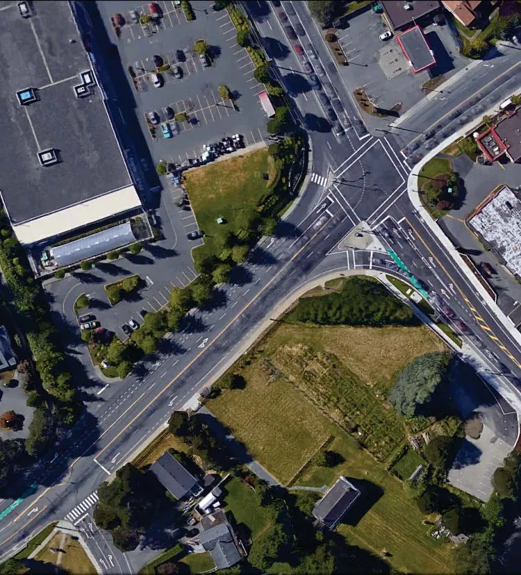 Aerial map of the intersection of Island Highway, Admirals Road, and Shoreline Drive with overlaid traffic performance data for 2018 PM total conditions using observed trip rates.