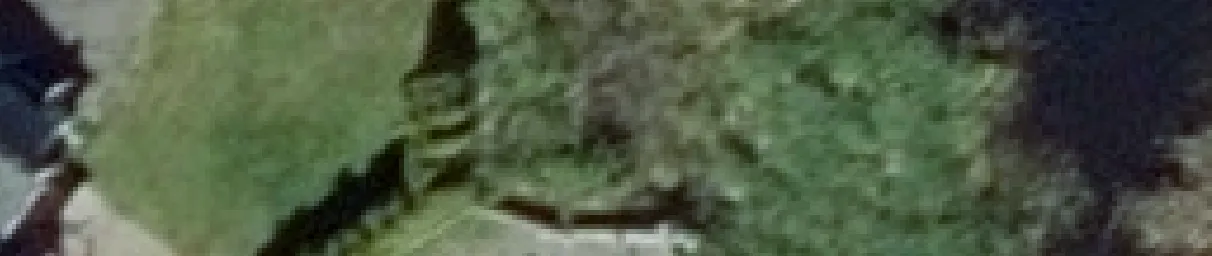 Aerial view crop of a house roof and chimney