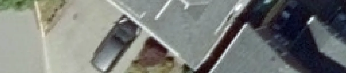 Aerial view crop of a house and landscaping
