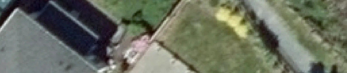 Aerial view crop of a curved street and residential driveway