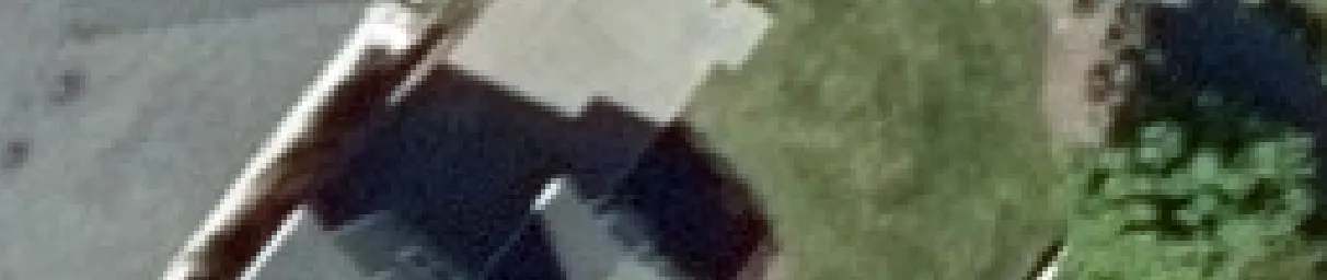 Aerial view crop of a roof and yard area