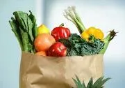 Brown paper bag filled with fresh produce