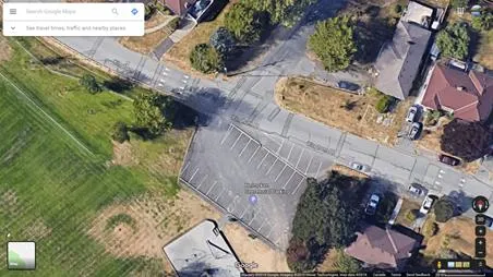 Aerial Google Maps view of the Helmken Centennial Park parking lot and surrounding streets