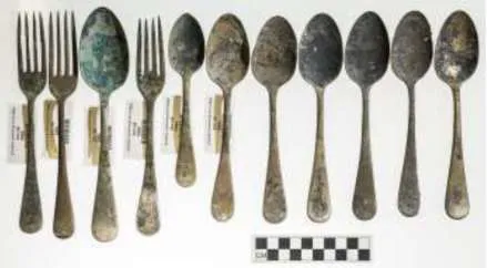 Set of recovered silverware including spoons and forks