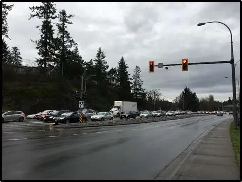 Photo of traffic congestion at a signalized intersection on a cloudy day