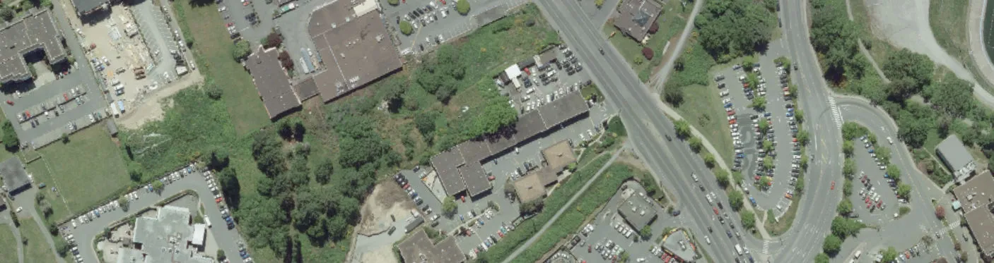 Aerial view of commercial buildings and parking lots
