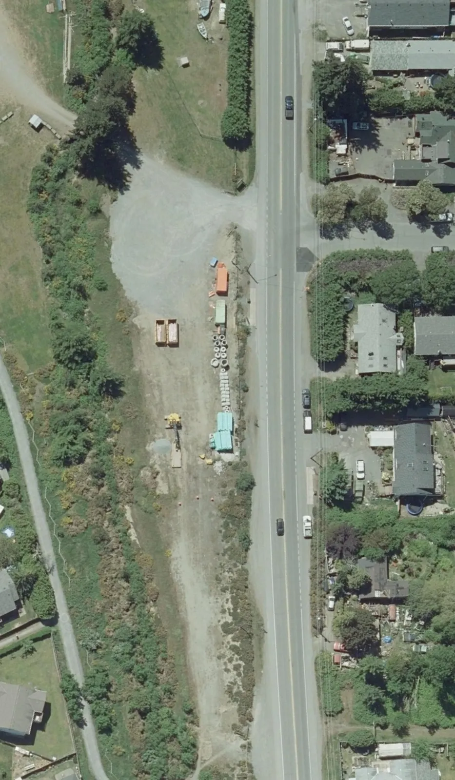 Conceptual layout overlay on an aerial photograph showing the design for the Luxton Park and Ride parking lot and its connection to the surrounding road and trail network.