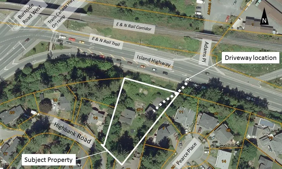 Air photo of the subject property at 371 Island Highway showing property lines and proposed driveway location