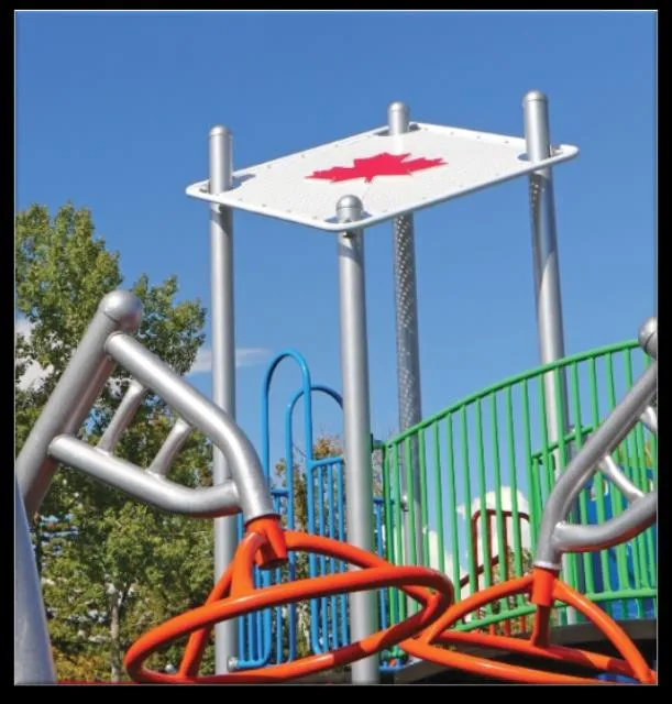 Photo of a playground structure with a Canadian maple leaf design
