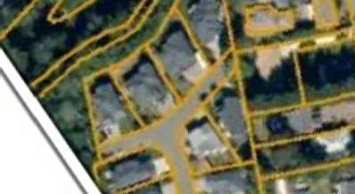 Detail view showing the Galloping Goose Regional Trail and the forested buffer between the site and the highway.