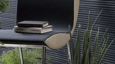 Sample of textured charcoal cladding with books