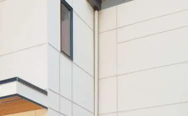 Building corner showing white Hardie Panel cladding