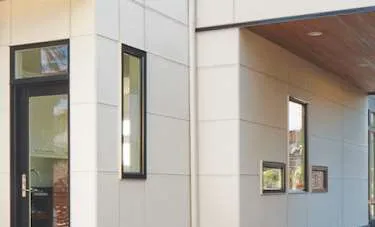 Facade detail showing building exterior with windows and white panels