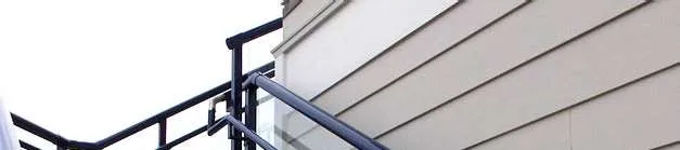 Exterior staircase with glass and picket aluminium guards