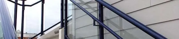 Detail of glass guardrail on exterior staircase