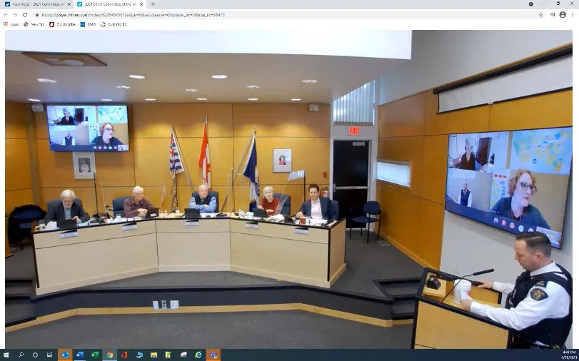 Wide shot of Council Chambers showing the podium and Council table