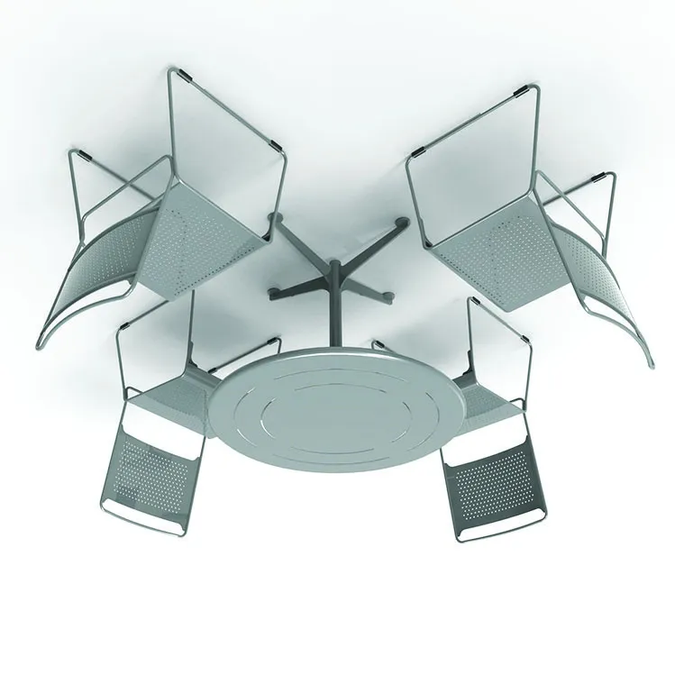 Round metal outdoor table with four matching perforated metal chairs