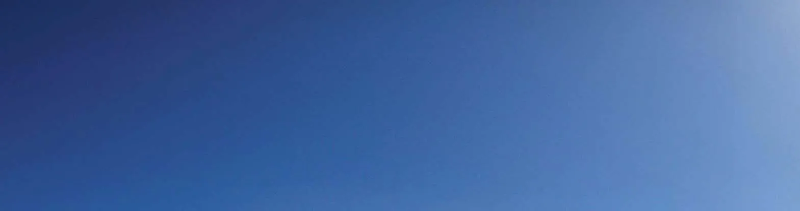 Clear blue sky at the top of a coastal scene