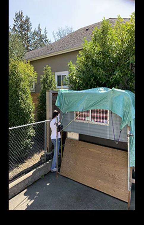 Photo of an undersized 'import camperette' stored on wooden brackets