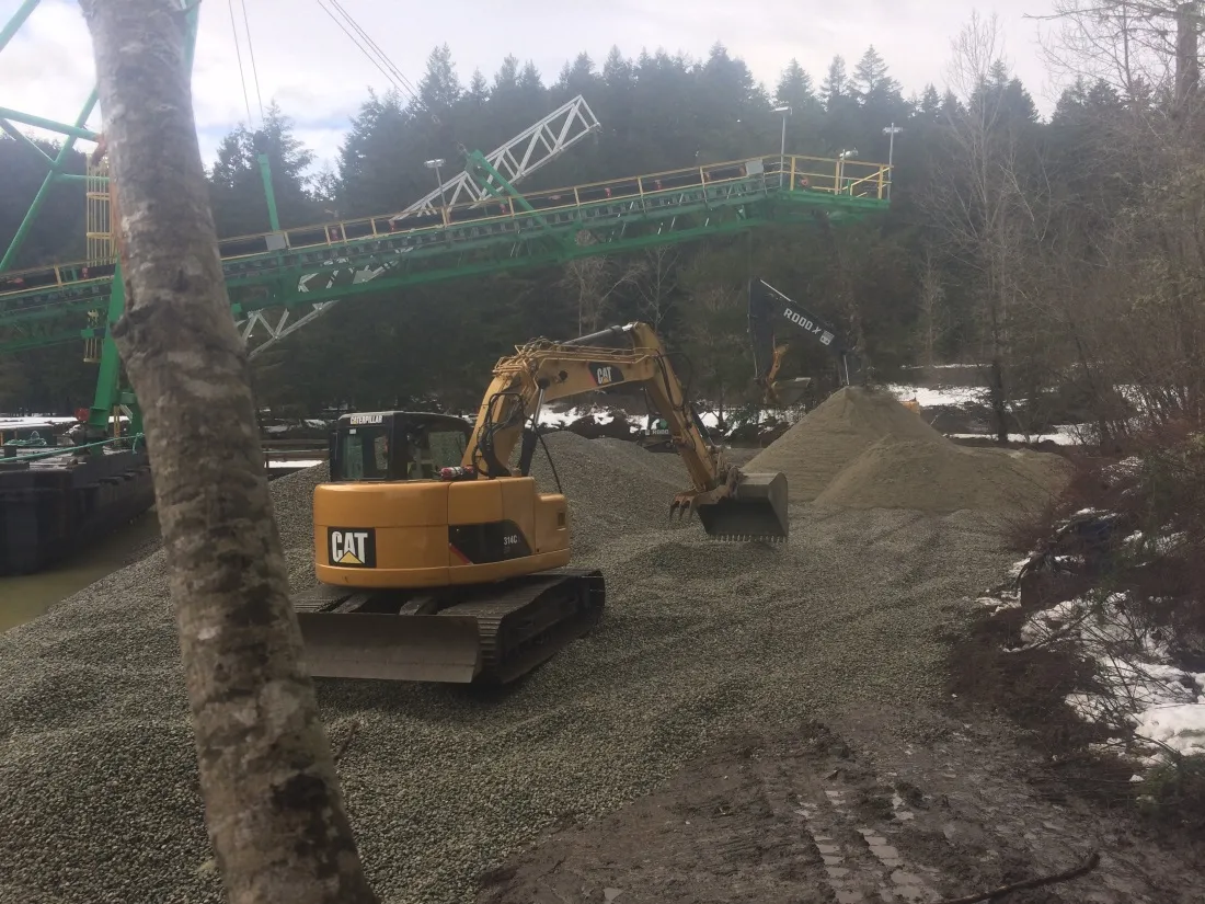 Tod Inlet Beach project site showing a truck and conveyor system over the water