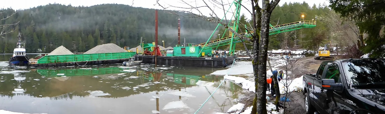 Tod Inlet Beach project site showing an excavator working at the water's edge
